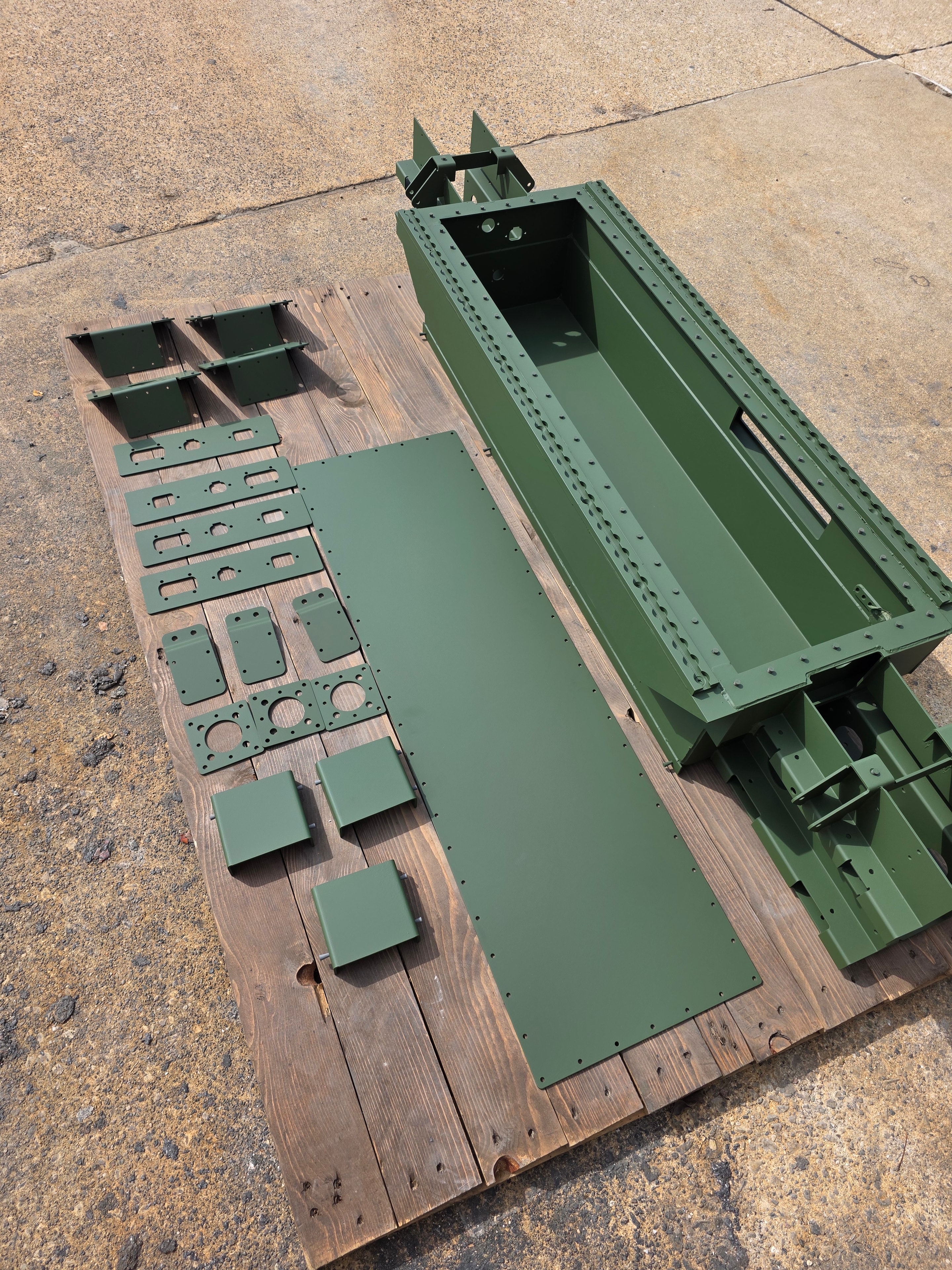 Heavy steel fabrication components with matte gray powder coat